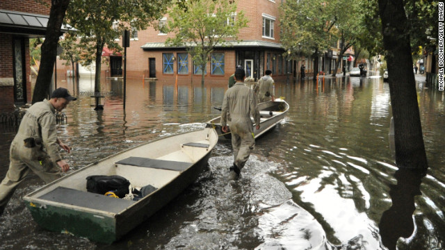 Members of the State University of New York Maritime Academy aid in the relief efforts, using row boats to help victims from in Hoboken, New Jersey.