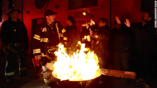 Residents of New York City's East Village enjoy a bonfire on Wednesday, October 31.