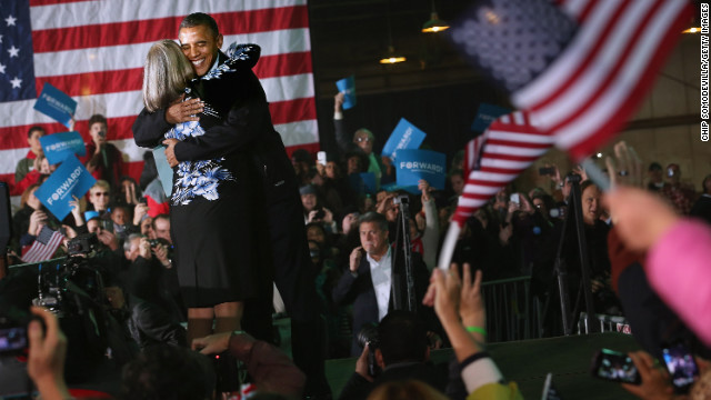 President Barack Obama embraces Judith Kamalay after she introduced him during a campaign rally Friday, November 2, in Hilliard, Ohio.