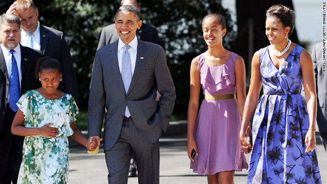 U.S. President Barack Obama walks to church with his wife, first lady Michelle Obama, and their daughters Sasha, left, and Malia, right in 2011.