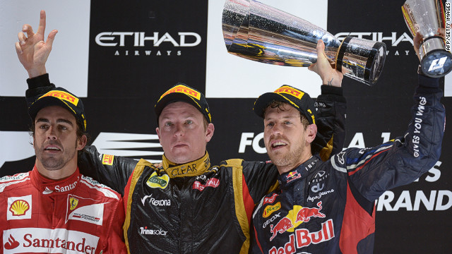 Fernando Alonso, left, and title rival Sebastian Vettel, right, with Abu Dhabi winner Kimi Raikkonen. 