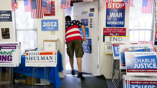 Volunteer David Bowser peeks outside the Pinellas County Democratic Party headquarters in St. Petersburg, Florida.