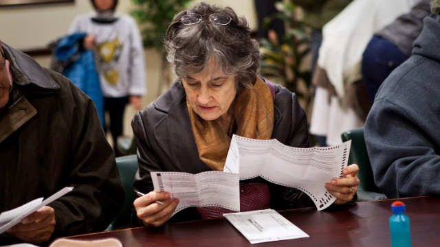 A woman fills out an early voting ballot on Sunday, November 4, in Jersey City, New Jersey. Gov. Chris Christie ordered early voting stations to stay open through the weekend in an effort to get people to vote despite the damage done by Superstorm Sandy.