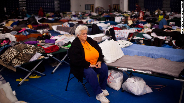 Ruth Hawfield sits next to her cot Monday in a Red Cross evacuation shelter at Toms River High School.