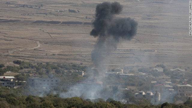 Smoke rises after an explosion in the Syrian village of Bariqa near the the cease-fire line in the Israeli-controlled Golan Heights on Wednesday, November 7. Israel is asking the U.N. Security Council to address an intrusion by Syrian tanks into the buffer zone between Syria and Israel in the Golan Heights, which Israel says violates the two countries' Separation of Forces agreement.