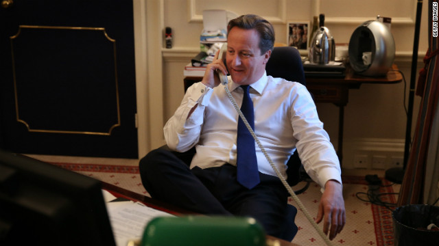 Photo: David Cameron congratulates Obama