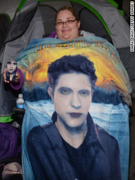 A fan shows off her "Twilight" phone case and blanket.