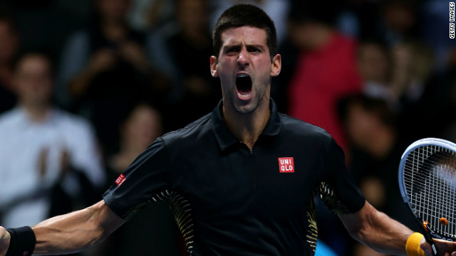 Novak Djokovic celebrates as he closes out his ATP World Tour Finals match with Roger Federer to take the title. 
