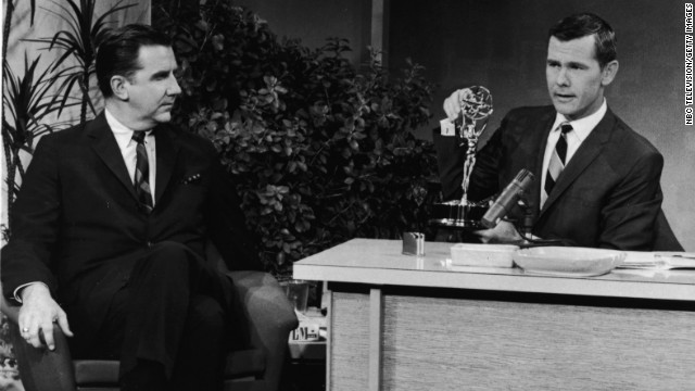 In 1963, Johnny Carson sits with an Emmy award on his desk beside announcer Ed McMahon.