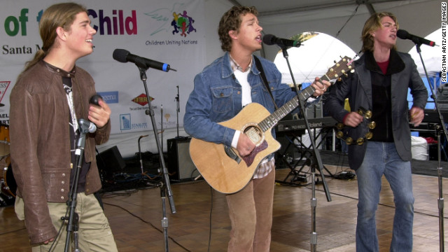 Isaac, Taylor and Zac Hanson of Hanson perform in 2001. The brothers became superstars with their 1997 album "Middle of Nowhere" thanks to a little earworm called "MMMBop."