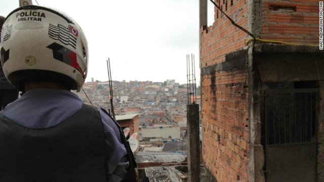 Military police stand on a hill overlooking Brasilandia -- a shantytown in northern Sao Paulo, Brazil -- during an anti-gang raid.