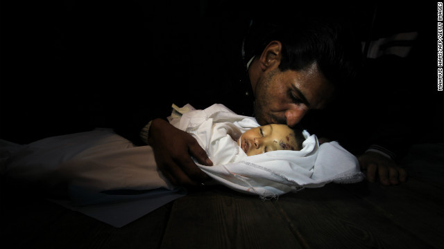 Palestinian relatives mourn over the body of Hanen Tafish, a 10-month-old girl, at the morgue of the al-Shifa hospital in Gaza City on Thursday after she died following an Israeli air strike in the Zeitun neighbourhood.