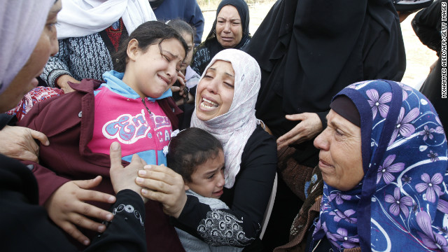 Palestinian women and children cry during the funeral of Audi Naser on Friday, November 16.