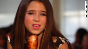 Nicole Westbrook, 12, sings into a turkey leg in \