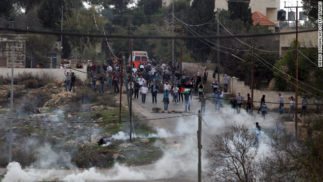 Birzeit University students clash with Israeli soldiers on Monday.