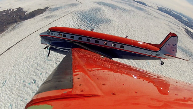 POLAR 6 banking over a glacier near Kangerlussuaq in Greenland en route to a radar survey flight over Greenland's inland ice.