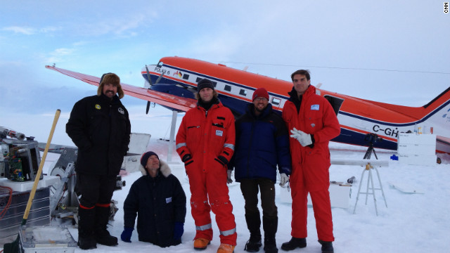 Ice core drilling crew with CNN correspondent Fred Pleitgen. Glaciologist Sepp Kipfstuhl standing in a hole for fun!