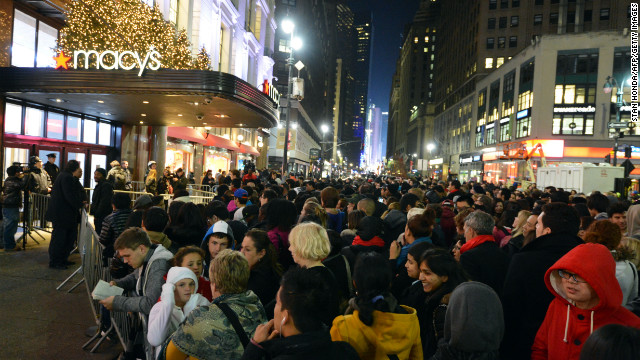 Crowds gather outside Macy's department store on Thanksgiving Day in New York in advance of the midnight opening.