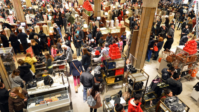 The first floor of Macy's in New York is crowded when the store opens at midnight.