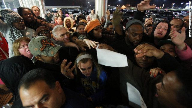 Shoppers wait for a Kmart to open on Thanksgiving night, November 22, 2012, in Griffith, Indiana. Like many chains, the store got a head start on the traditional Black Friday sales by opening on Thursday.