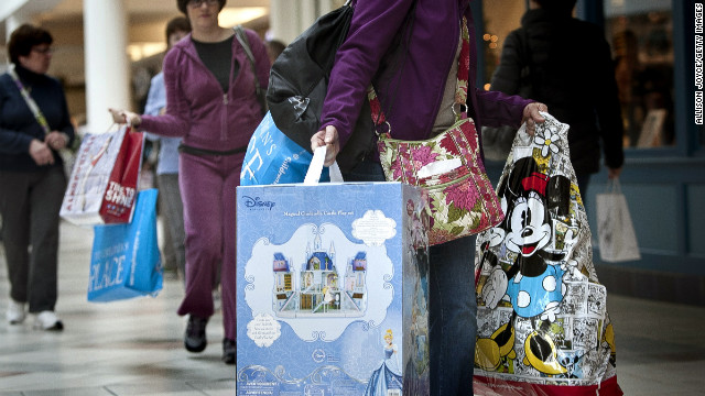 Shoppers carry bags during Black Friday sales at the South Shore Plaza in Braintree, Massachusetts. 