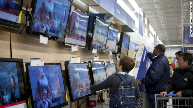 Shoppers pick out televisions at Walmart during Black Friday sales in Quincy, Massachusetts.