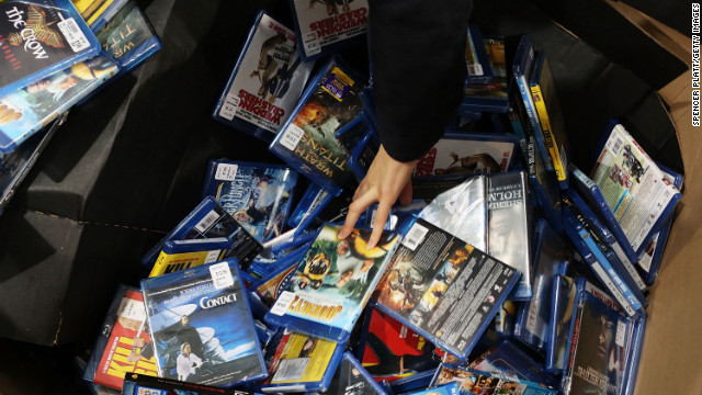 A shopper looks through movies and games at a Best Buy store in Naples, Florida.