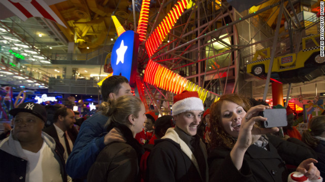 Shoppers enter Toys R Us in Times Square on Thanksgiving Day.