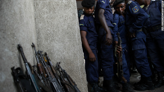 Surrendered police officers hand-in their weapons at the Volcanoes Stadium in Goma, in the east of the Democratic Republic of the Congo, on November 21, 2012.