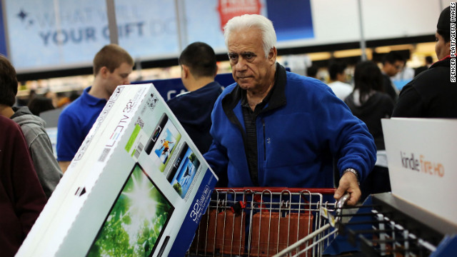 Shoppers move through a Best Buy store in Naples.