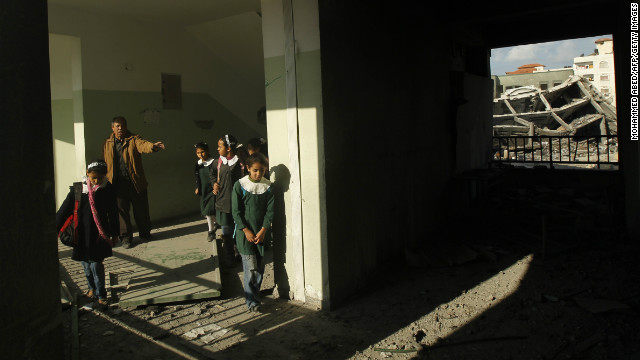 Palestinians school girls walks along a corridor of their school in Gaza City on Saturday.