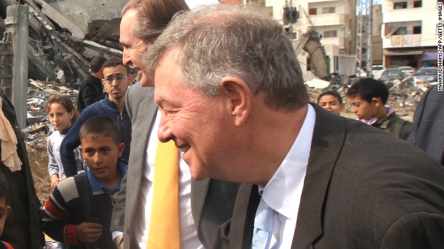 Robert Serry, the United Nations Special Coordinator for the Middle East Peace Process, greets children during a visit to Gaza to survey damage caused by the exchange of fire between Israel and Hamas militants, on Sunday, November 25.