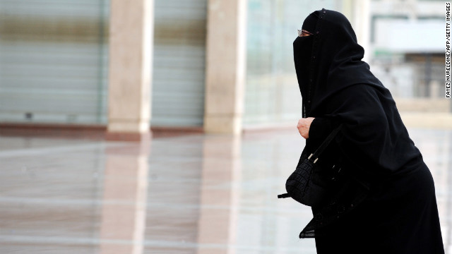 A fully veiled Saudi woman walks into a mall in Riyadh. Women's 