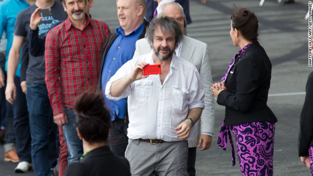 "Hobbit" director Peter Jackson (c), pictured here at Wellington airport, has filmed a number of blockbusters in his native New Zealand.