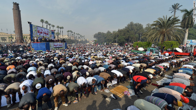 Thousands pray during a rally in support of Morsy in front of Cairo University on December 1.