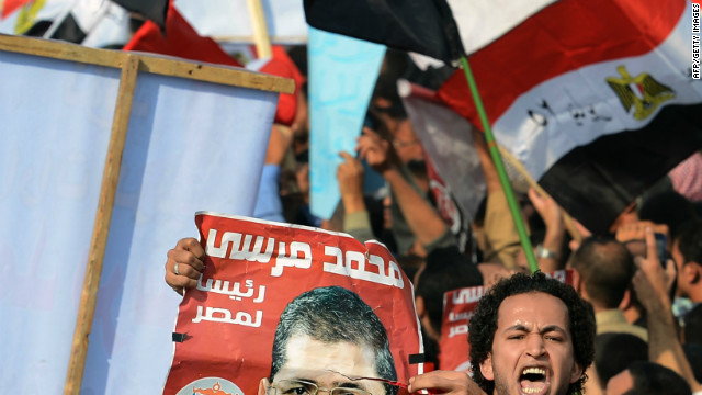 Amid continued unrest, Egypt's president sets vote for constitution referendum
