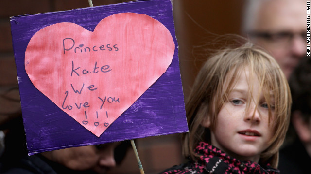 A young child holds up a banner as Catherine visits Alder Hey Children's NHS Foundation Trust on February 14, 2012, in Liverpool, England.