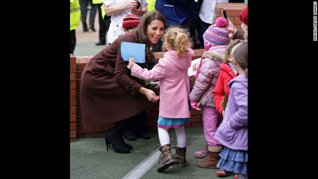 Catherine greets a young girl during a walkabout as she visits Alder Hey Children's Hospital on February 14, 2012, in Liverpool, England.