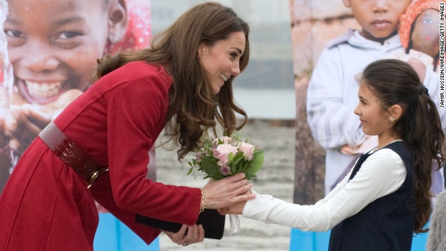 Catherine receives a bouquet of flowers from a young girl during her visit to the UNICEF Centre on November 2, 2011, in Copenhagen, Denmark.