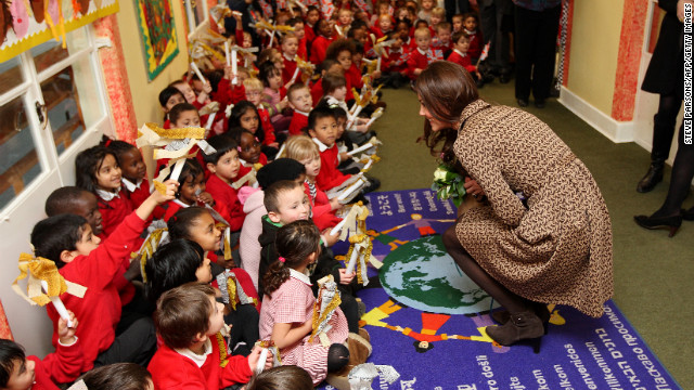 Catherine, right, speaks with schoolchildren during an official visit to the Art Room facilities at Rose Hill Primary School in Oxford on February 21, 2012.