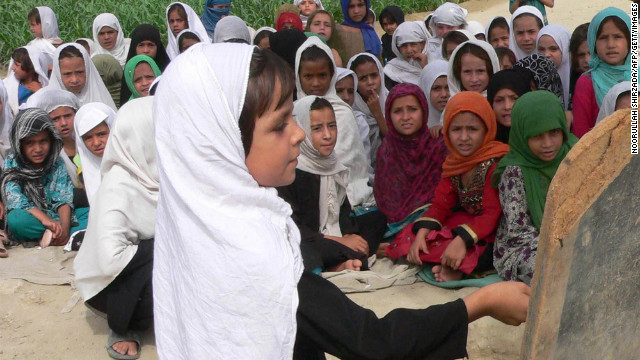 Afghan schoolgirls study in an open air school in Jalalabad. Violence against women is a major problem in Afghanistan.