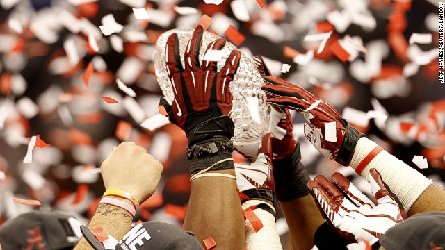 January 9: Members of the Alabama Crimson Tide hold the BCS trophy after defeating the LSU Tigers to win the National Championship college football title in New Orleans.