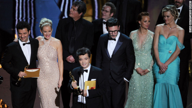 February 26: Surrounded by the cast and crew, producer Thomas Langmann accepts the best picture award for "The Artist" during the 84th Annual Academy Awards in Hollywood. The silent, black-and-white film garnered five Oscars.