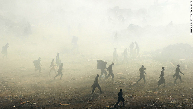 March 7: Children and adults scavenge for recyclables and other usable items at the Trutier dump on the outskirts of Port-au-Prince, Haiti. Following the devastating 2010 earthquake that killed more than 220,000 people, the number of daily scavengers at the landfill grew from about 200 to an estimated 2,000. Much of the country is still in crisis.