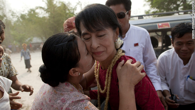 April 1: A supporter kisses Aung San Suu Kyi, leader of the National League for Democracy, as she visits polling stations in her constituency as Burmese vote in parliamentary elections in Kawhmu, Myanmar. She won a seat in parliament in Myanmar's first multiparty elections since 1990.