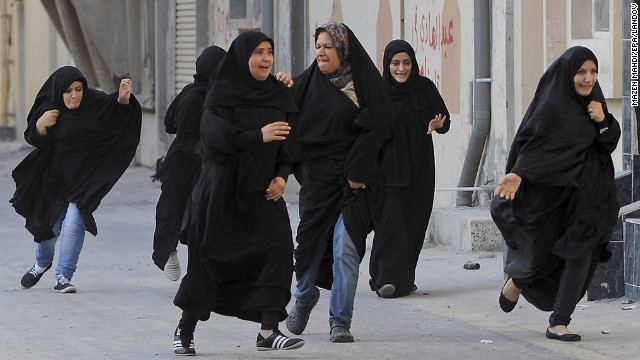 June 27: Protesters run for cover as police arrive to disperse a rally demanding human rights reforms in the village of Buri, south of Bahrain's capital, Manama. A court in Bahrain sentenced prominent activist Nabeel Rajab to three years in prison in August "for participating in illegal rallies and gatherings."