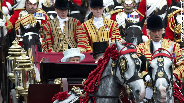 June 5: Britain's Queen Elizabeth II waves from her seat in the 1902 State Landau coach during the carriage procession from Westminster Hall to Buckingham Palace to celebrate the Queen's Diamond Jubilee. 