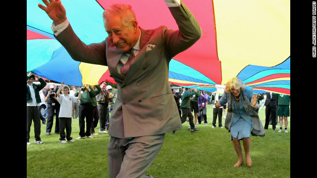 July 19: Prince Charles, Prince of Wales, and Camilla, Duchess of Cornwall, take part in a parachute game during a visit to Saumarez Park in St Peter Port, United Kingdom. They were taking part in a Diamond Jubilee visit to the Channel Islands.