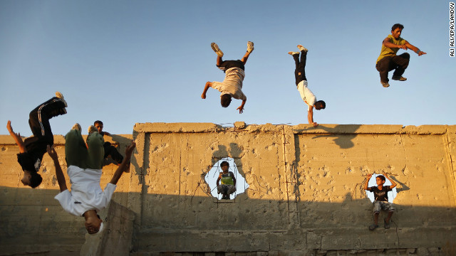 September 17: Palestinian youths practice their parkour skills in Khan Younis in southern Gaza. Parkour athletes run along a route, using obstacles to propel themselves. The practice originiated in France.