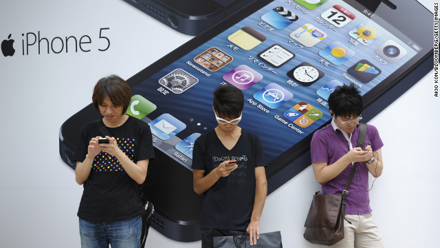 September 21: People stand outside a store in Tokyo before the launch of the iPhone 5. Based on first-day orders, the iPhone 5 became the fastest-selling device Apple has released.